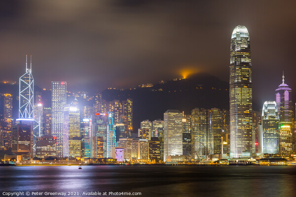 Tsim Shat Sui Victoria Harbour In Hong Kong At Night Picture Board by Peter Greenway