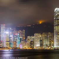 Buy canvas prints of Tsim Shat Sui Victoria Harbour In Hong Kong At Night by Peter Greenway