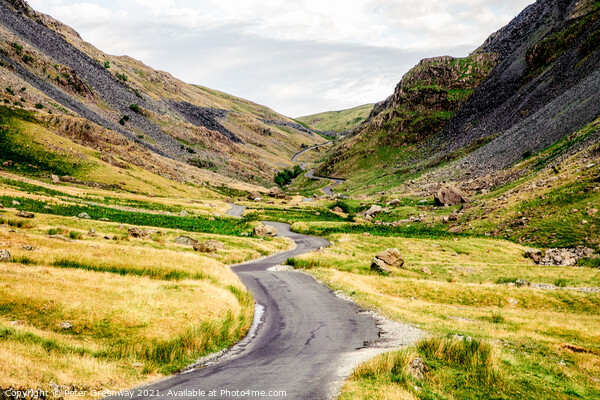 The Winding Road Through The Honiston Pass In The Lake District Picture Board by Peter Greenway