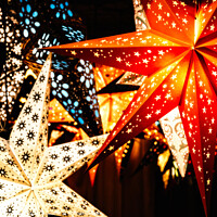 Buy canvas prints of Colourful Illuminated Christmas Star Decorations by Peter Greenway