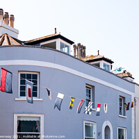 Buy canvas prints of Regatta Bunting Flying Outside Cottages In Shaldon by Peter Greenway