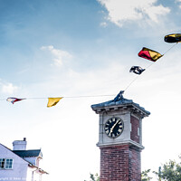 Buy canvas prints of Regatta Bunting On The Clock Tower In Shaldon, Dev by Peter Greenway