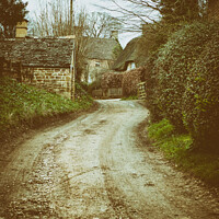 Buy canvas prints of Thatched Cottages Down A Windy English Country Lane by Peter Greenway