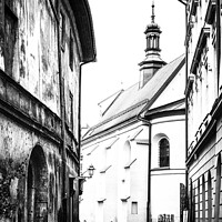 Buy canvas prints of Cobbled Street & A Church In The Old Town In Kracow by Peter Greenway