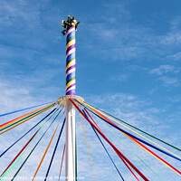 Buy canvas prints of The Woved Coloured Ribbon Patterns On The Maypole by Peter Greenway