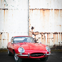 Buy canvas prints of Red Classic Sports Car Rusty Hangar Doors by Peter Greenway