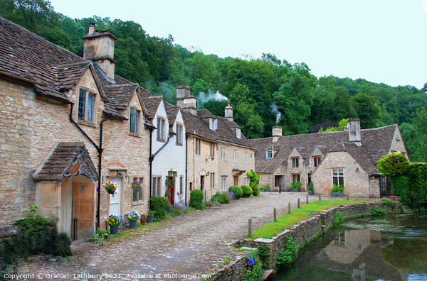 Castle Combe Cottages Picture Board by Graham Lathbury