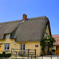 Buy canvas prints of "The" Thatched Cottage by Graham Lathbury