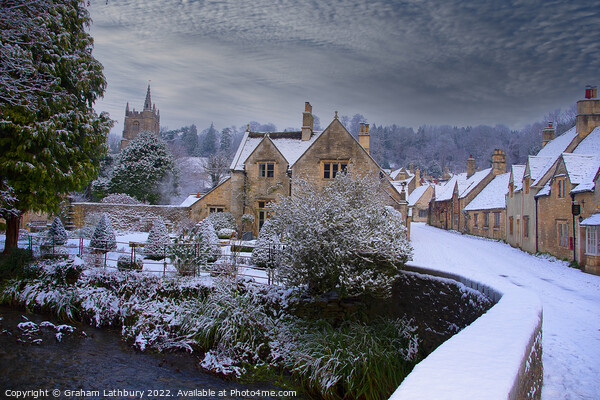 Castle Combe in the snow Picture Board by Graham Lathbury