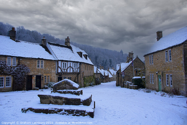 Castle Combe, Cotswolds, in the snow Picture Board by Graham Lathbury