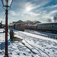 Buy canvas prints of Locomotives on a snow-covered station platform by Stuart Chard