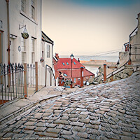 Buy canvas prints of Whitby town cobbled streets and seaview by Stuart Chard