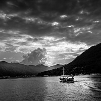 Buy canvas prints of Boat and mountains at sunset - black and white by Stuart Chard