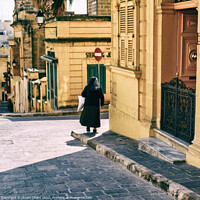 Buy canvas prints of Nun standing by the door at the St. Theresa School by Stuart Chard