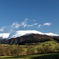 Buy canvas prints of Snow capped Skiddaw viewed from Wythop Valley by Peter Wiseman