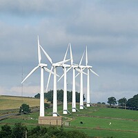 Buy canvas prints of Roadside wind turbines by Roy Hinchliffe
