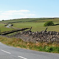 Buy canvas prints of Winding Pennine country road by Roy Hinchliffe