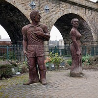 Buy canvas prints of Sculptures of man and woman in Dewsbury by Roy Hinchliffe