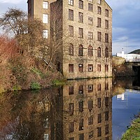 Buy canvas prints of Building reflections in the Huddersfield canal by Roy Hinchliffe