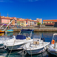 Buy canvas prints of Boats at the harbor in the old town of Collioure, a seaside resort in Southern France by Chun Ju Wu