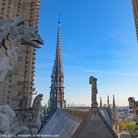 Buy canvas prints of The Gargoyles at the top of Notre Dame Cathedral in Paris, France by Chun Ju Wu