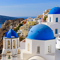Buy canvas prints of Blue domed church and traditional white houses facing Aegean Sea in Oia, Santorini, Greece by Chun Ju Wu