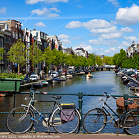 Buy canvas prints of Bikes on the bridge that crosses the canal in Amsterdam, Netherlands by Chun Ju Wu