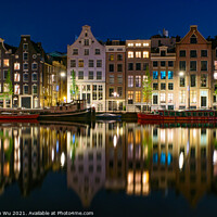 Buy canvas prints of Reflection of the buildings along the canal at night in Amsterdam, Netherlands by Chun Ju Wu