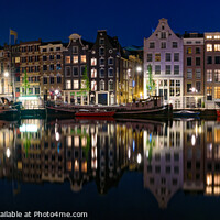 Buy canvas prints of Panorama of the buildings along the canal at night in Amsterdam, Netherlands by Chun Ju Wu