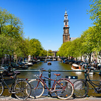 Buy canvas prints of Bikes on the bridge that crosses the canal in Amsterdam, Netherlands by Chun Ju Wu