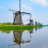 Buy canvas prints of The windmills and the reflection on water in Kinderdijk, a UNESCO World Heritage site in Rotterdam, Netherlands by Chun Ju Wu