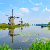 Buy canvas prints of The windmills and the reflection on water in Kinderdijk, a UNESCO World Heritage site in Rotterdam, Netherlands by Chun Ju Wu