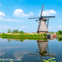Buy canvas prints of Panorama of the windmills and the reflection on water in Kinderdijk, a UNESCO World Heritage site in Rotterdam, Netherlands by Chun Ju Wu