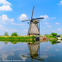 Buy canvas prints of Panorama of the windmills and the reflection on water in Kinderdijk, a UNESCO World Heritage site in Rotterdam, Netherlands by Chun Ju Wu