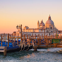 Buy canvas prints of Basilica di Santa Maria della Salute and gondolas on the sea at sunrise / sunset time, Venice, Italy by Chun Ju Wu
