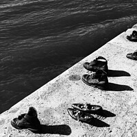 Buy canvas prints of Shoes on the Danube Bank, a memorial for the Jews killed during World War II in Budapest, Hungary (black & white) by Chun Ju Wu