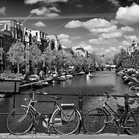 Buy canvas prints of Bikes on the bridge that crosses the canal in Amsterdam (black & white) by Chun Ju Wu