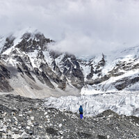 Buy canvas prints of A man standing in front of the glacier at Himalayas mountain range in Nepal by Chun Ju Wu