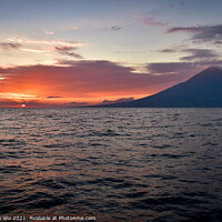 Buy canvas prints of Sunset on the sea with a volcano in Indonesia by Chun Ju Wu