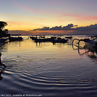 Buy canvas prints of A boy walking through the sea water with sunset at background in Bali, Indonesia by Chun Ju Wu