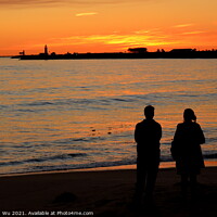 Buy canvas prints of Silhouette of a couple watching sunset on beach in Fremantle, WA, Australia by Chun Ju Wu