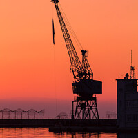 Buy canvas prints of Port crane at sunset by Nic Croad