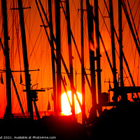 Buy canvas prints of Sunset through silhouetted yacht masts by Nic Croad