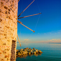 Buy canvas prints of Greek windmill on the beach by Nic Croad
