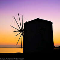 Buy canvas prints of Silhouette of a Greek windmill at sunset by Nic Croad