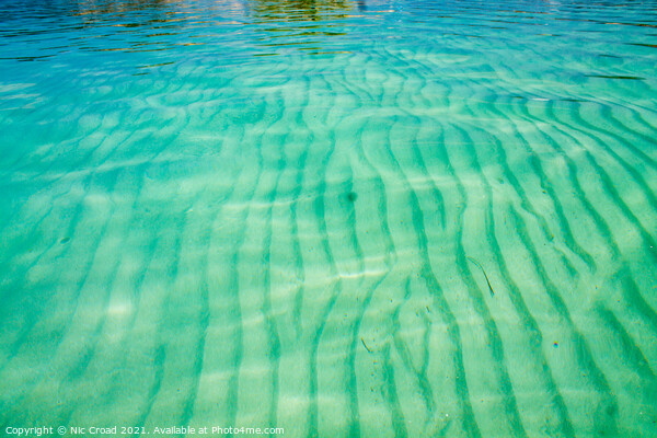 Sand ripple patters in a clear sea Picture Board by Nic Croad