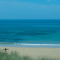 Buy canvas prints of A lone surfer leaving the beach at Constantine Bay, Cornwall by Frank Farrell