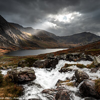 Buy canvas prints of Tryfan and Ogwen between the rain. by John Henderson