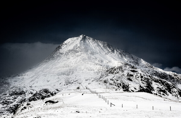 Crib Goch emerges from the clouds at sunrise Picture Board by John Henderson