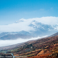 Buy canvas prints of Snowdon emerges from the clouds. by John Henderson